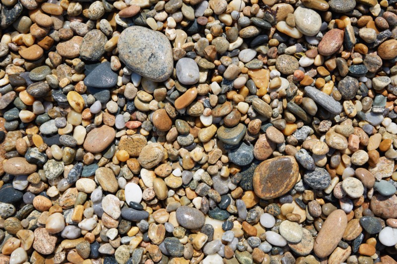 Overhead view of wet stones on beach