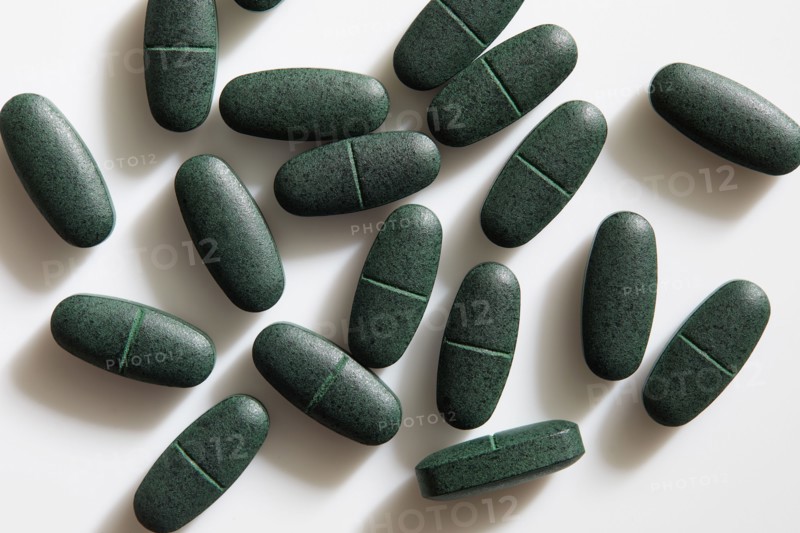 Studio shot of green pills