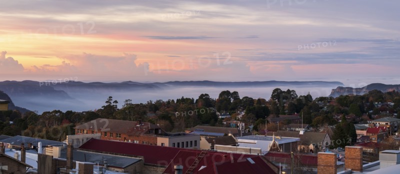 Townscape and mountains at sunset