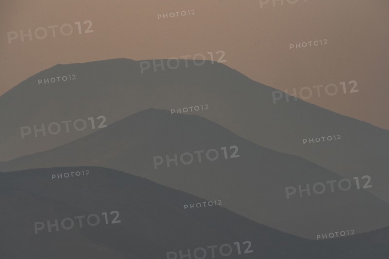 Silhouettes of layered mountains