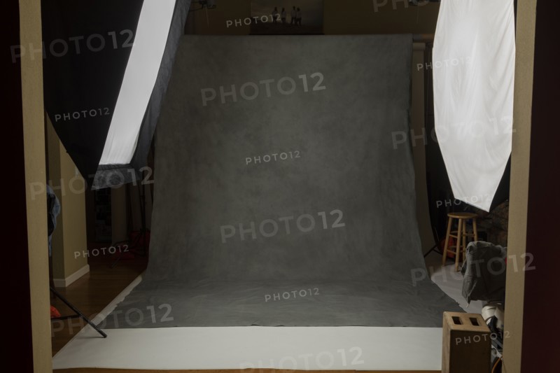 Photo studio set with lightboxes and painted muslin background