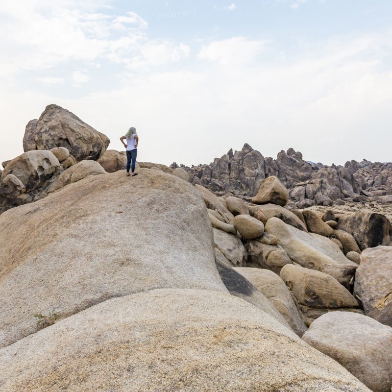 Woman looking at Alabama Hills