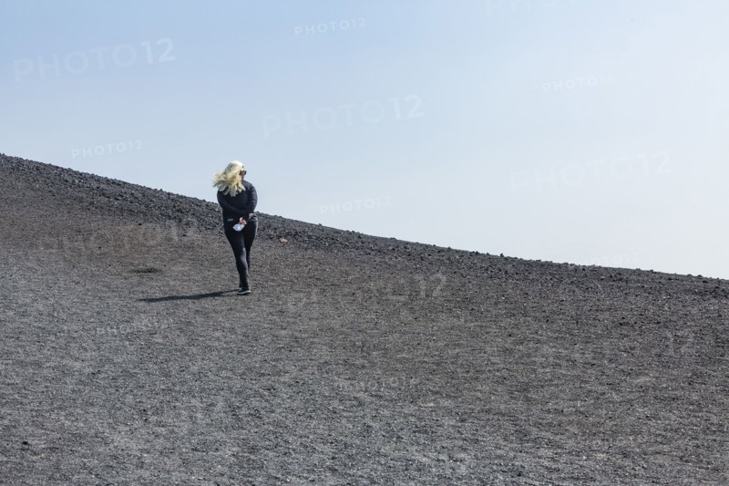 Woman hiking in cinder cone at Craters of the Moon National Monument