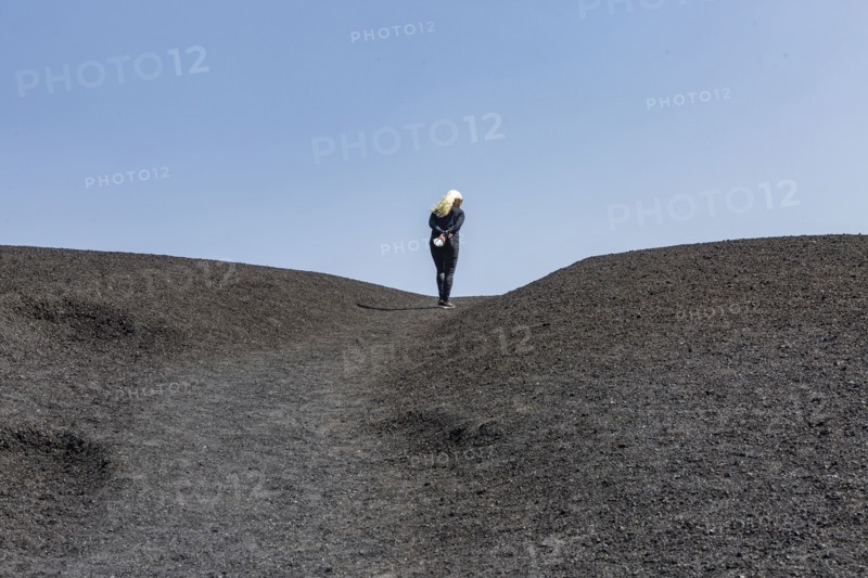 Woman hiking in cinder cone at Craters of the Moon National Monument