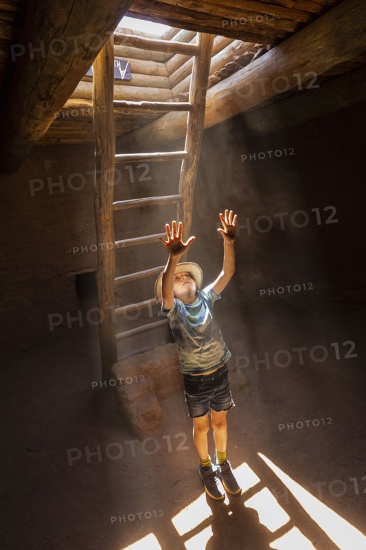 Boy exploring Native American kiva