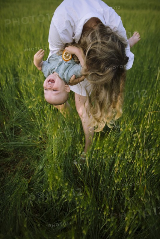Mother playing with baby son