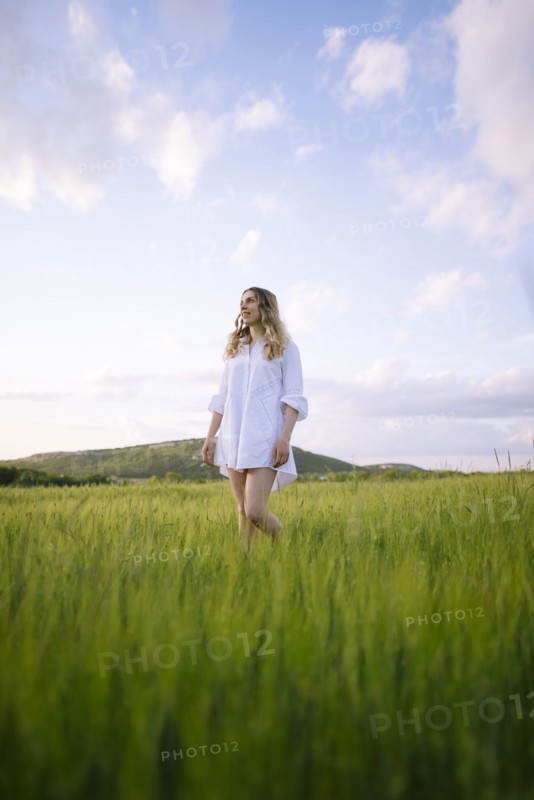 Young woman standing in agricultural field