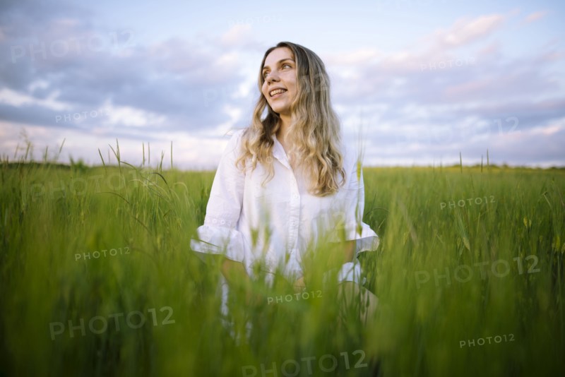 Young woman standing in agricultural field