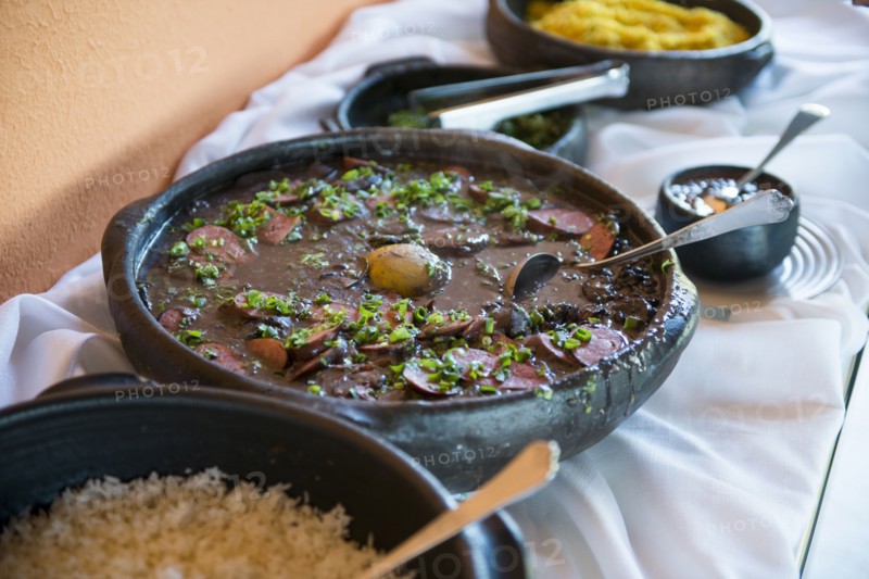 Bowls of traditional beans and rice on buffet table