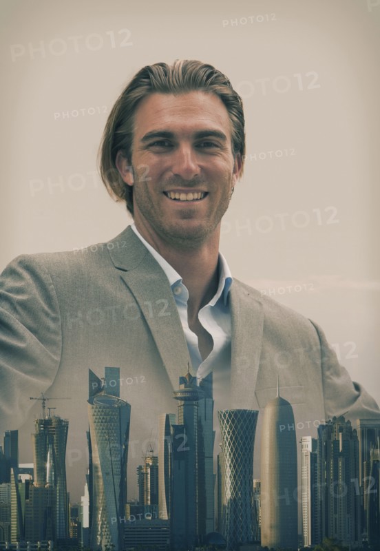 Caucasian businessman over Doha cityscape