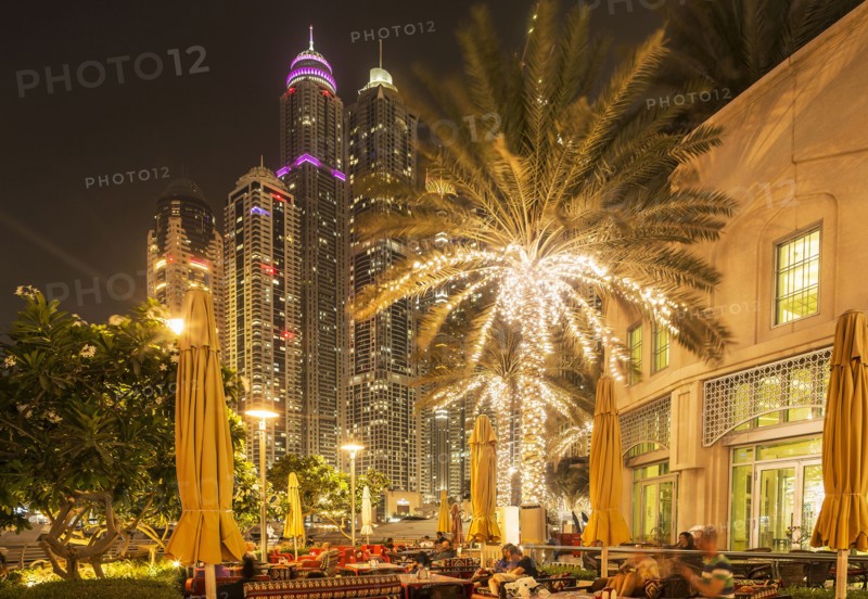 Illuminated high rise buildings in Dubai cityscape