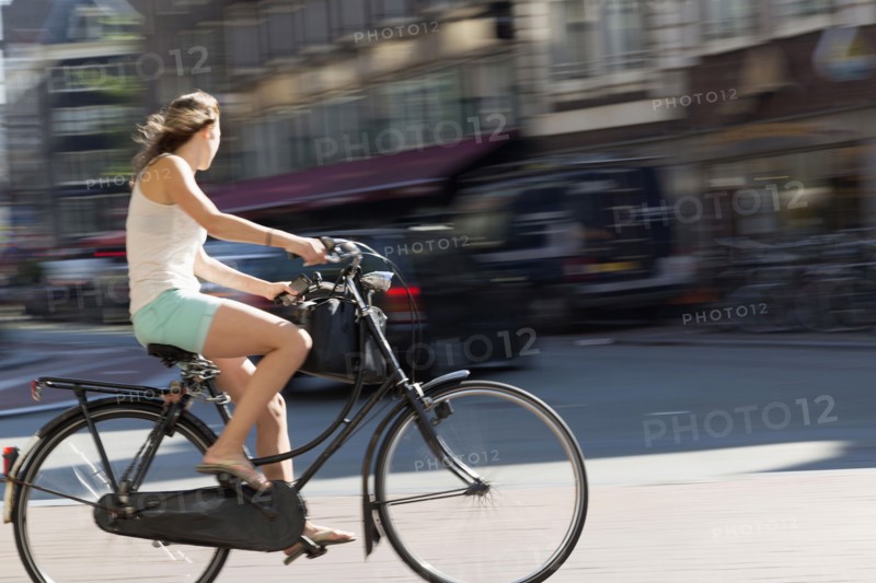 Blurred view of bicyclist on city street