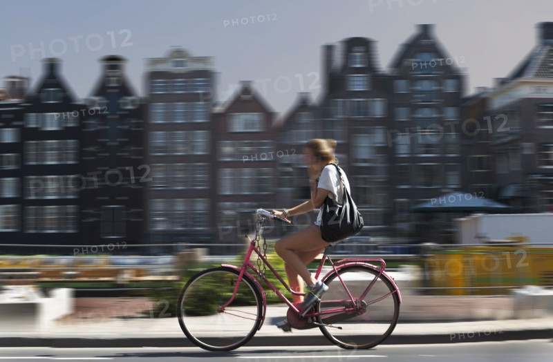 Blurred view of bicyclist on Amsterdam street