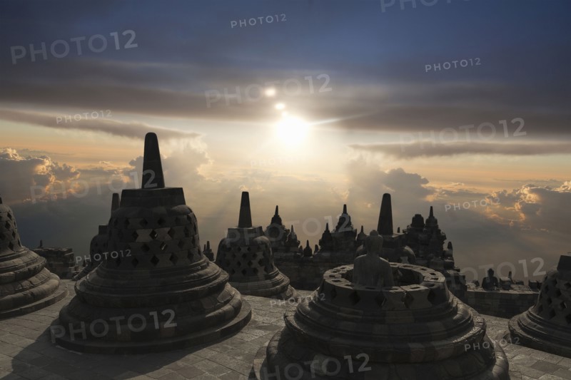 Spires on Temple of Borobudur at sunset