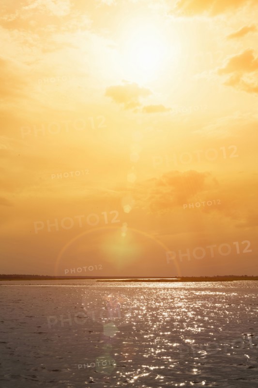 Sunset over rippling ocean water