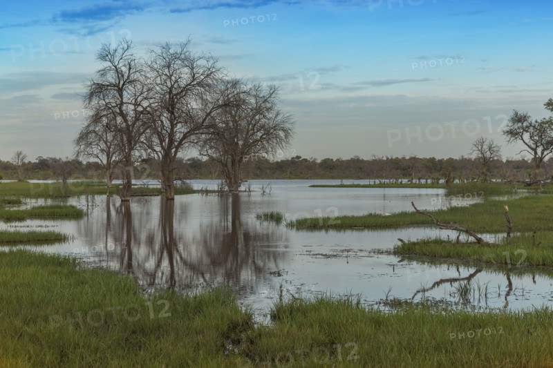 Clouds over pond in remote landscape