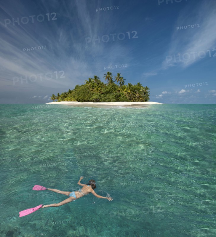 Caucasian woman snorkeling off tropical island