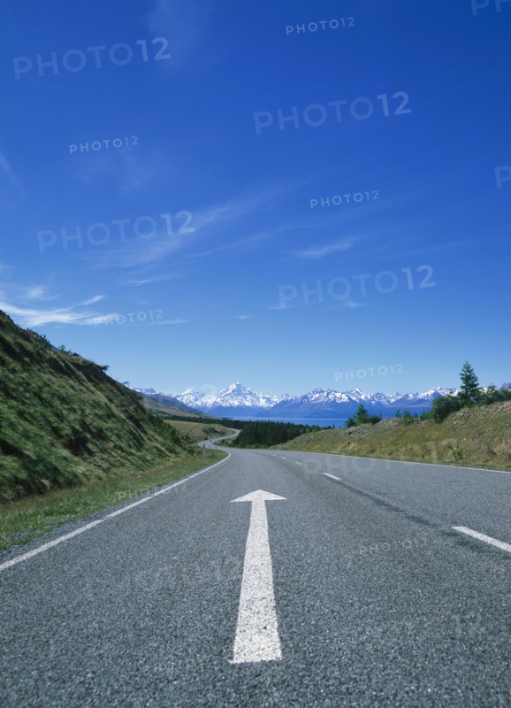 Directional arrow on empty remote road