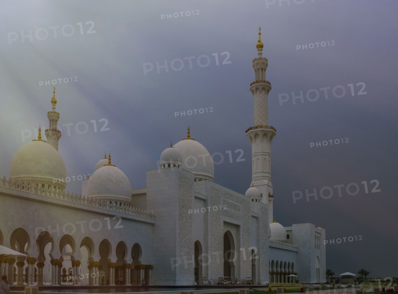 Ornate domed building under cloudy sky
