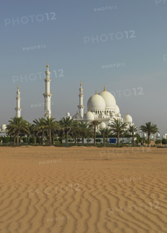 Ornate domed building in desert sand dunes