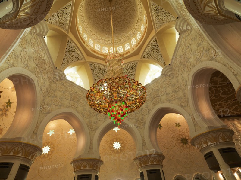 Low angle view of chandelier in ornate dome
