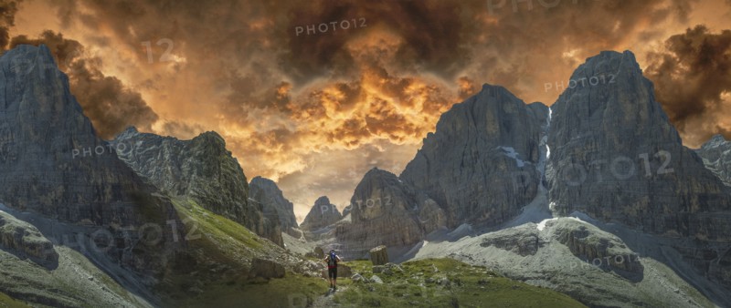 Caucasian hiker walking by remote mountains