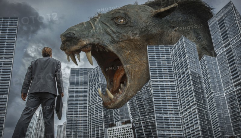 Caucasian businessman watching monster rat in city