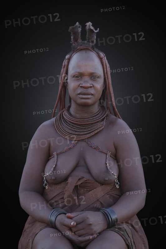 Black woman wearing traditional clothing and jewelry