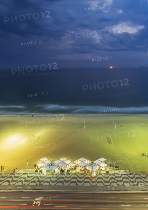 Aerial view of market on beach under cloudy sky