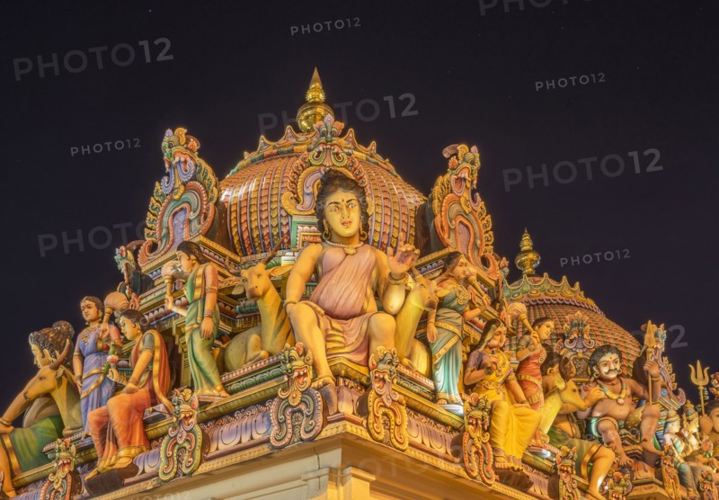 Low angle view of statues on ornate temple dome