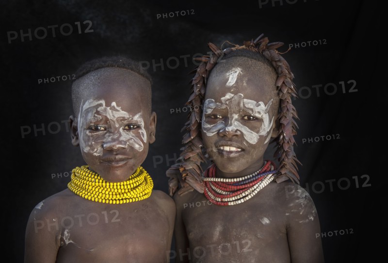 Black children with traditional face paint