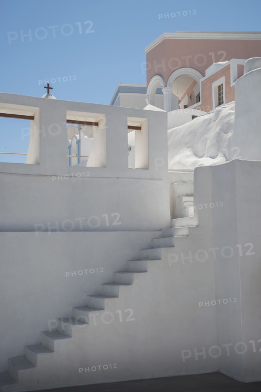 Steps on building wall under blue sky