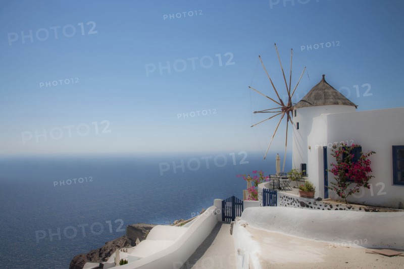 Building on hillside over cityscape