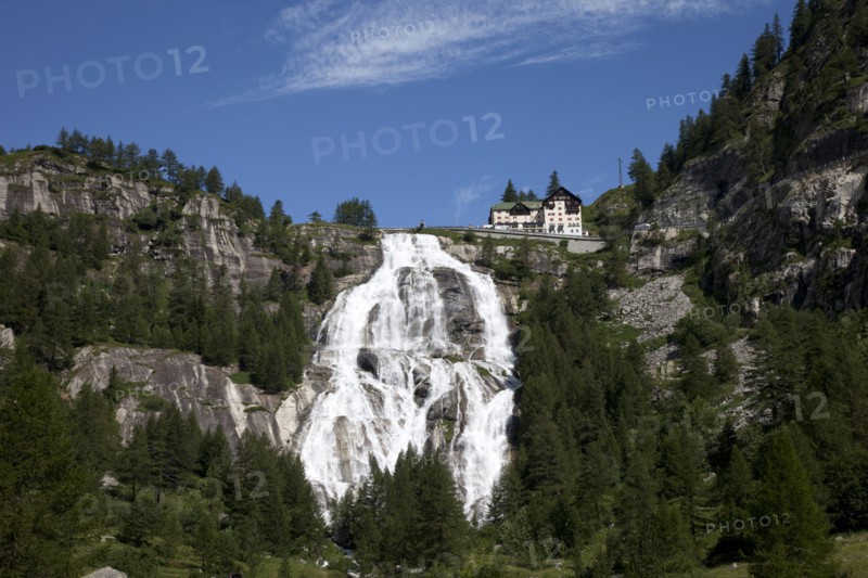 Building over waterfall on remote hillside