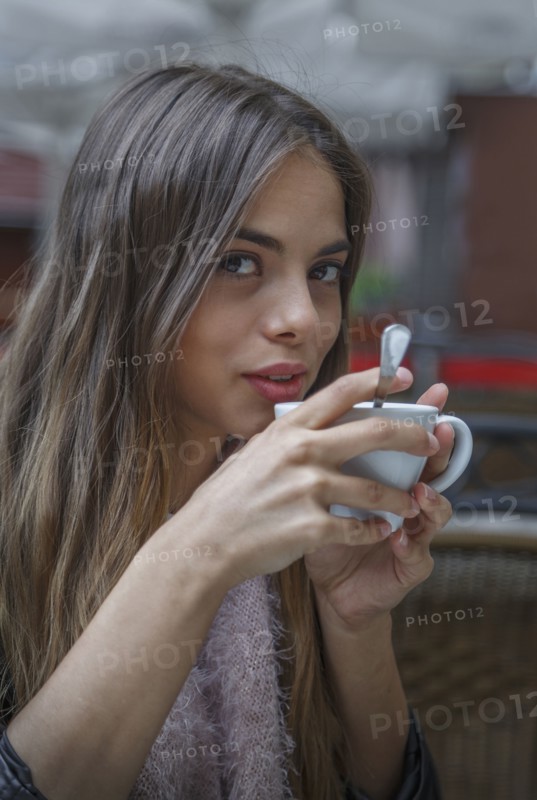 Caucasian woman drinking coffee