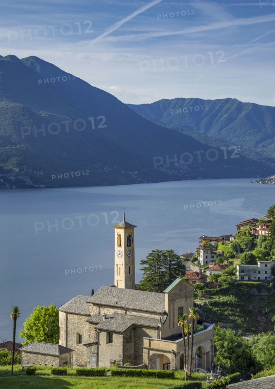 Aerial view of waterfront church and Lake Como