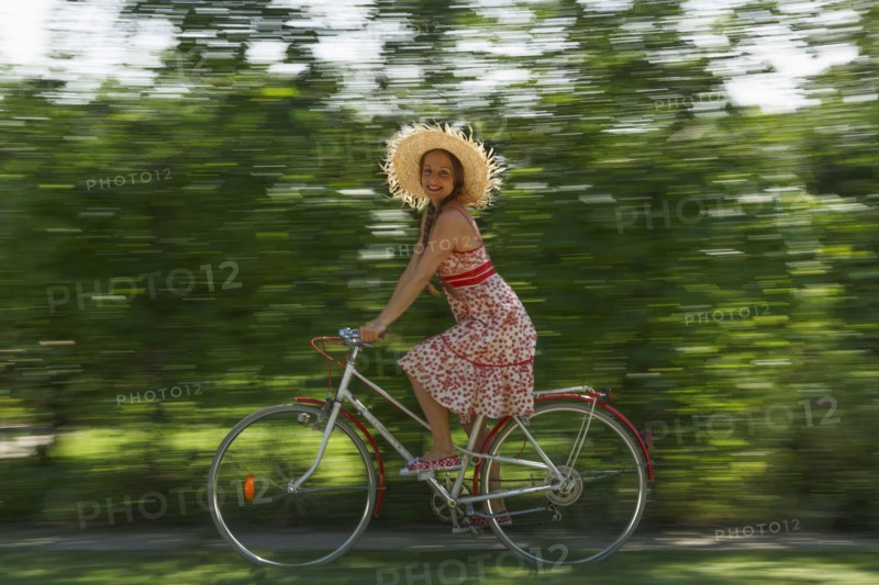 Caucasian woman riding bicycle