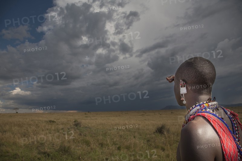Black man in traditional clothing admiring view