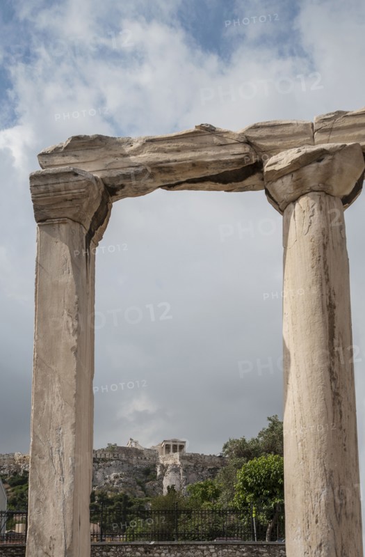 Ruin pillars and cloudy sky