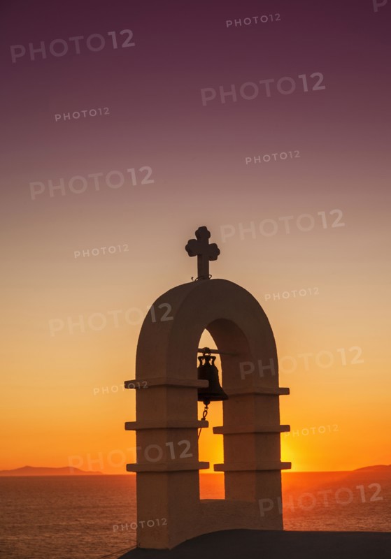 Bell arch with cross and sunset sky