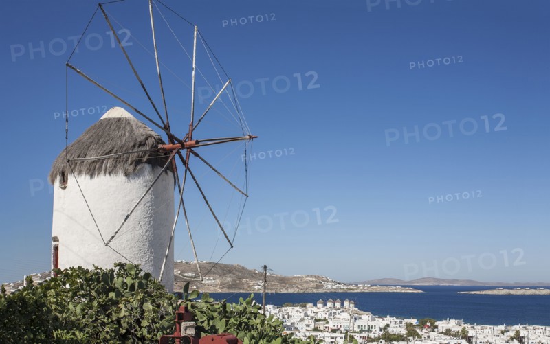 Traditional windmill and Mykonos cityscape