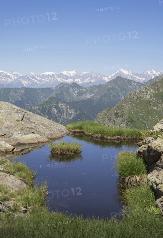 Pond on mountainside in Italian Alps