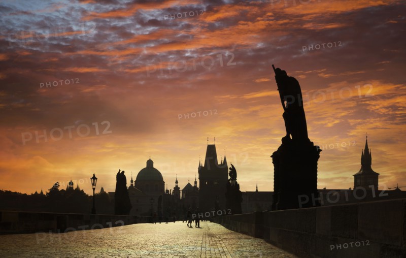 Silhouette of ornate buildings against sunset sky