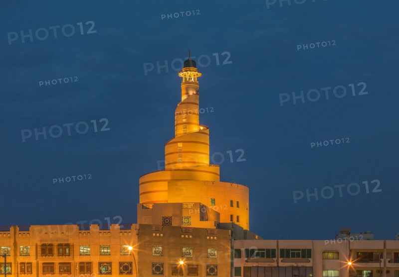 Islamic Cultural Center spire illuminated at night