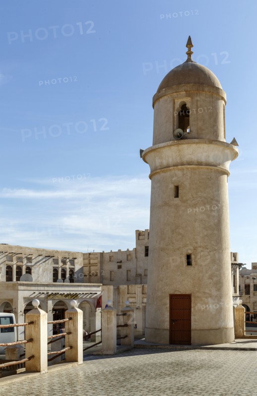 Ornate building and tower under blue sky