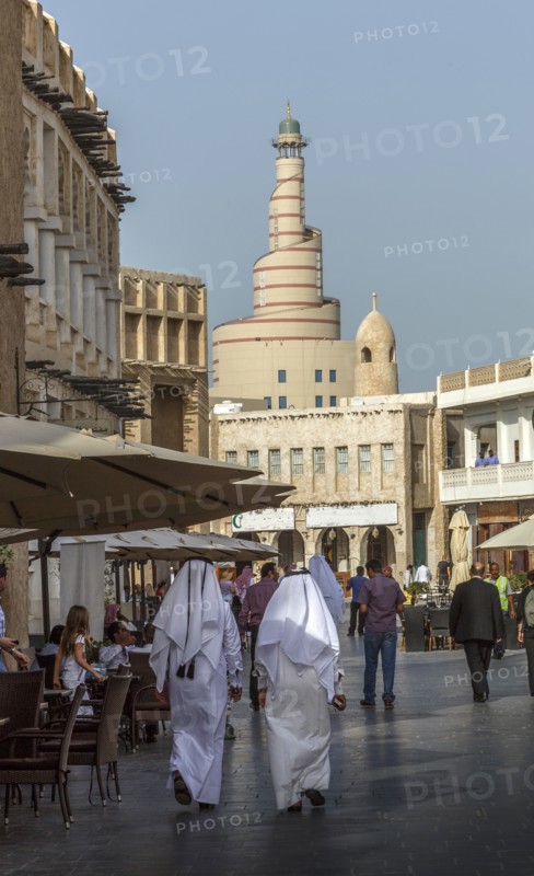 Men walking on Doha street