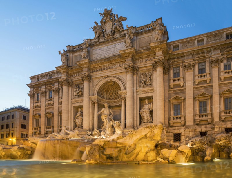 Trevi Fountain under ornate building