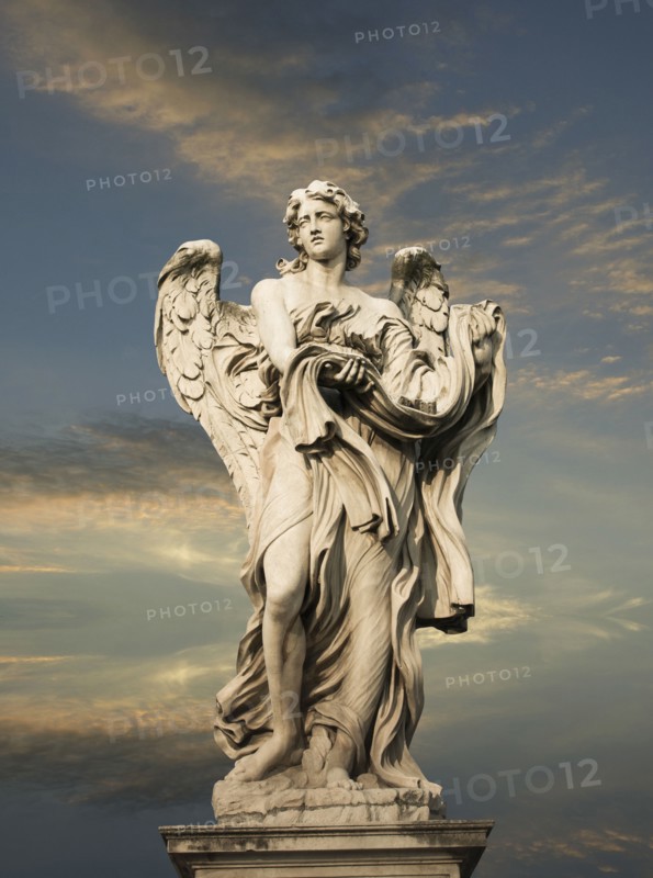 Low angle view of statue under cloudy sky