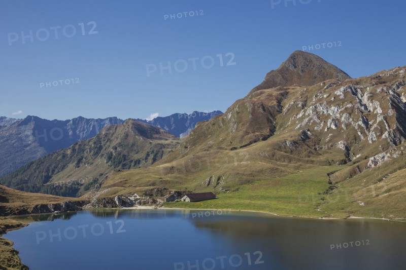 Mountains over still lake in remote landscape