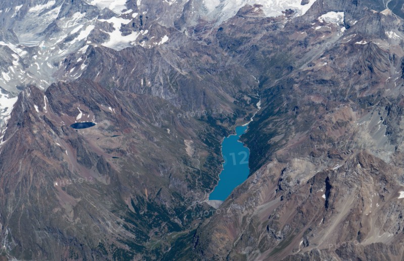 Aerial view of lakes in snowy mountain landscape